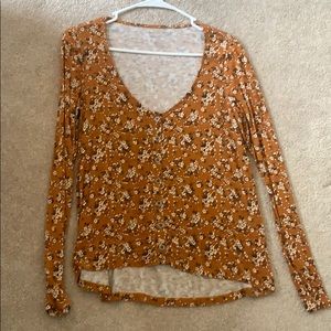 Orange floral patterned blouse